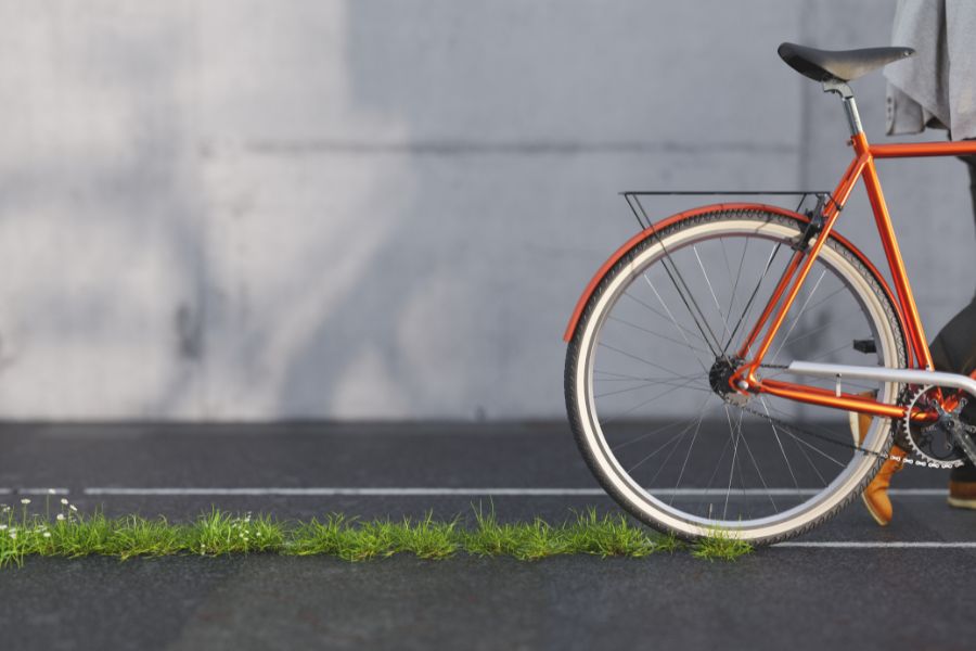 Bicycle leaving a green trail on the asphalt