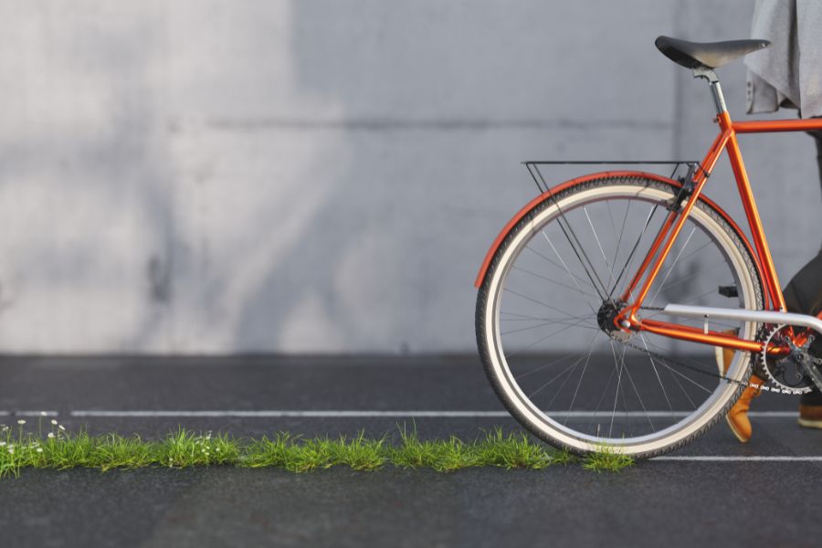 Bicycle leaving a green trail on the asphalt